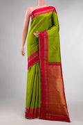 Parrot Green Dual Tone Kanchipuram Silk Saree with Stripes on the body and Zari Border displayed on a mannequin