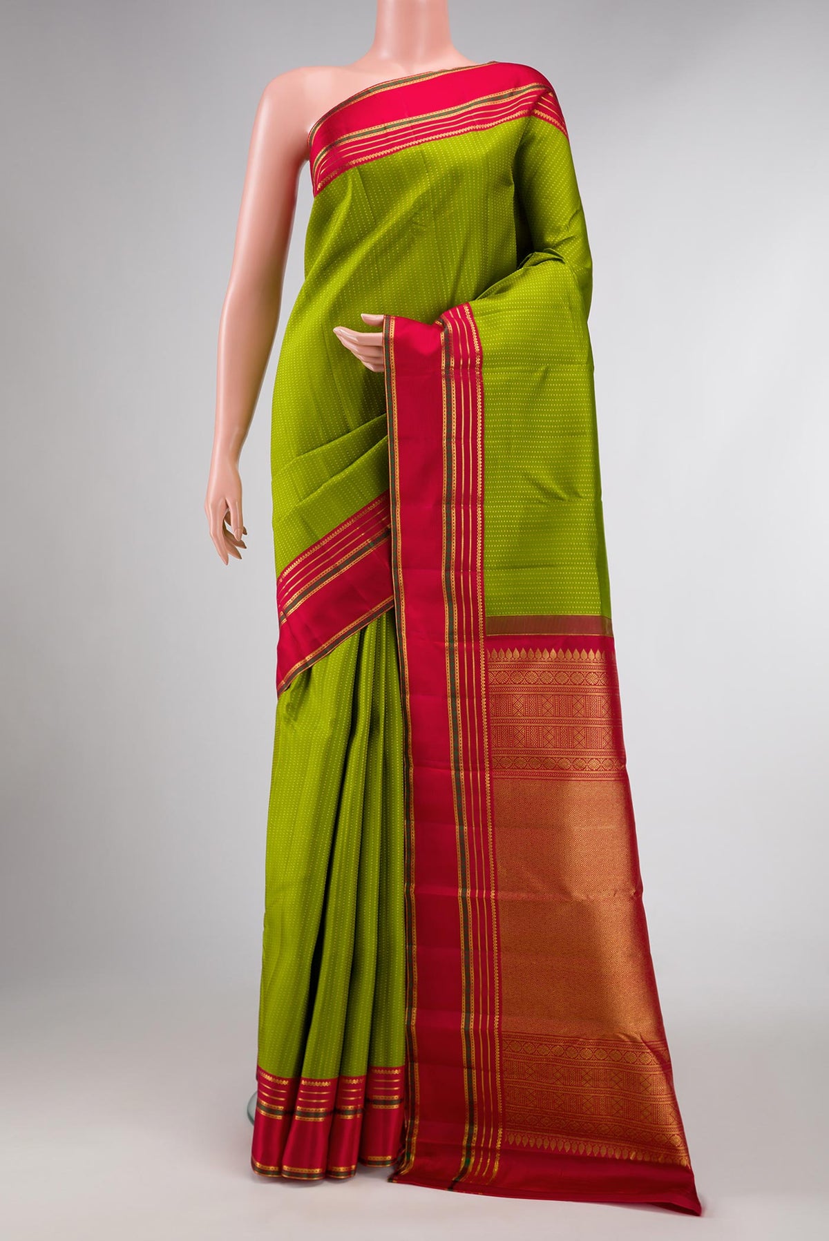 Parrot Green Dual Tone Kanchipuram Silk Saree with Stripes on the body and Zari Border displayed on a mannequin