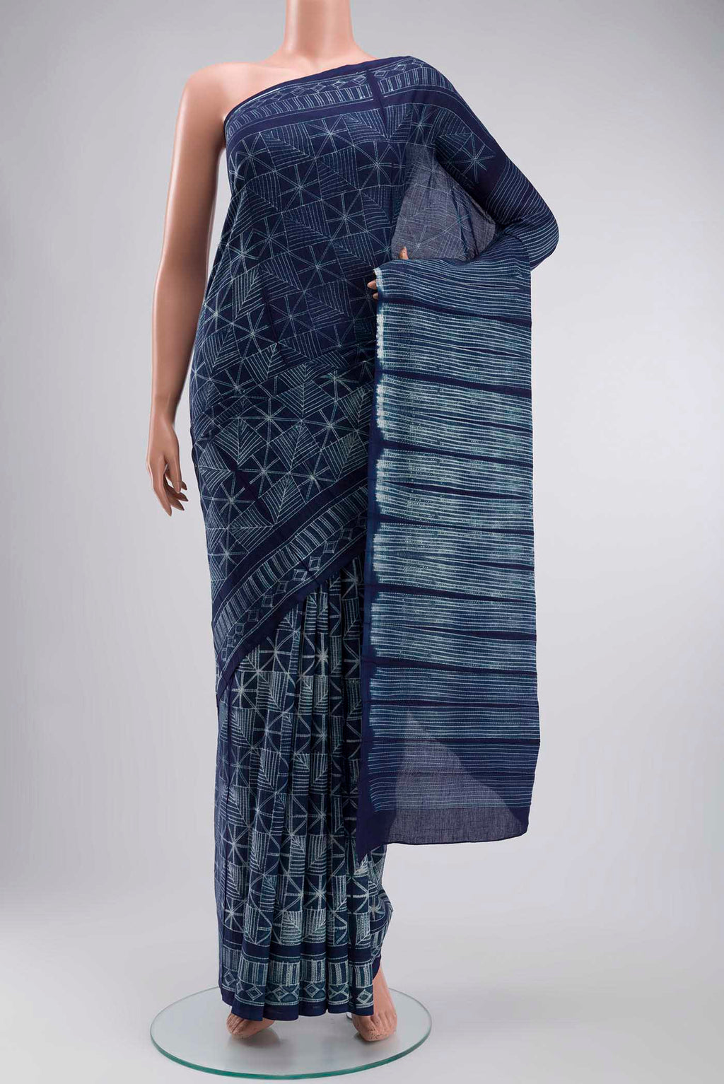 Navy Blue Cotton Saree with Printed design on the body and Printed Border displayed on a mannequin