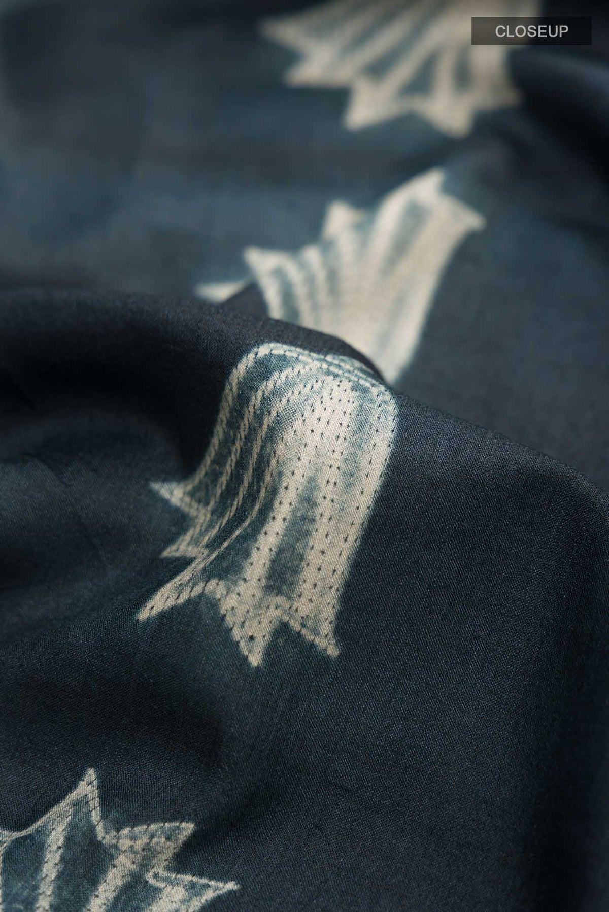 Close up of Grey Bhagalpuri Tussar Silk SareePrinted design on the body and Printed Border displaying folds