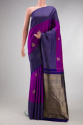 Purple Kanjivaram Silk Saree with Zari Butta on the body and Fancy Border.  displayed on a mannequin