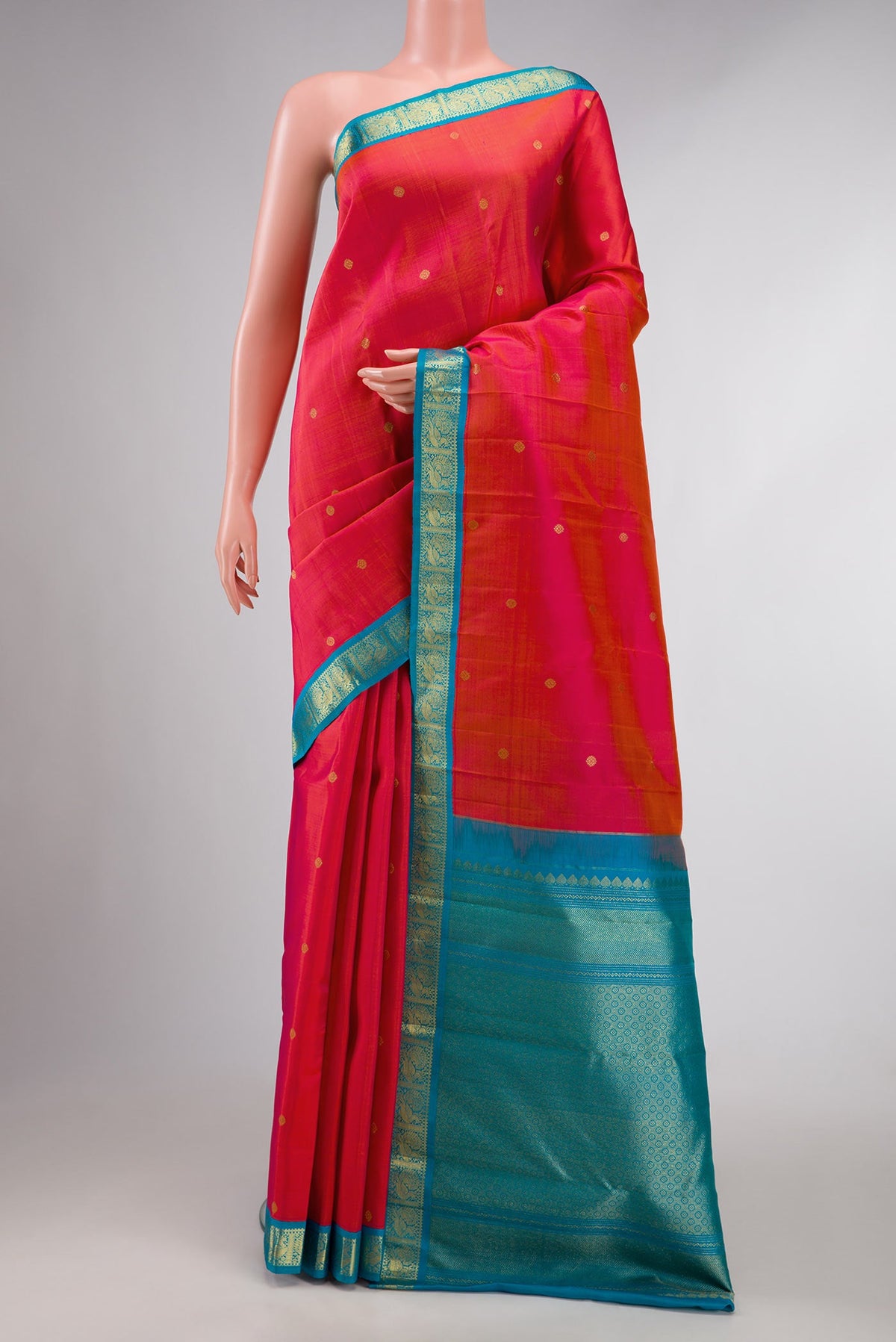 Dark Pink Dual Tone Kanchipuram Silk Saree with Zari Butta on the body and Zari Border displayed on a mannequin