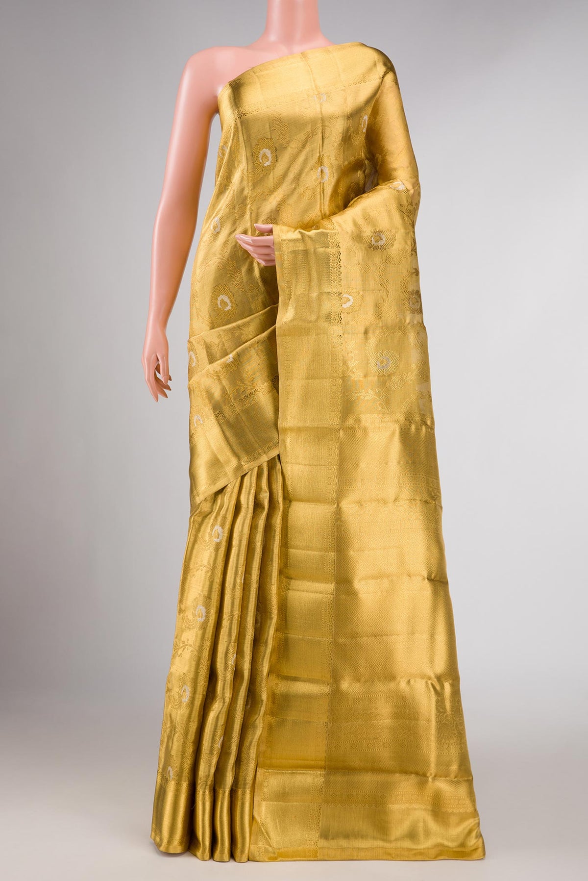 Pure Silk Pure Zari Gold Dual Tone Kanchipuram Tissue Saree with Zari Brocade on the body and Zari Border displayed on a mannequin
