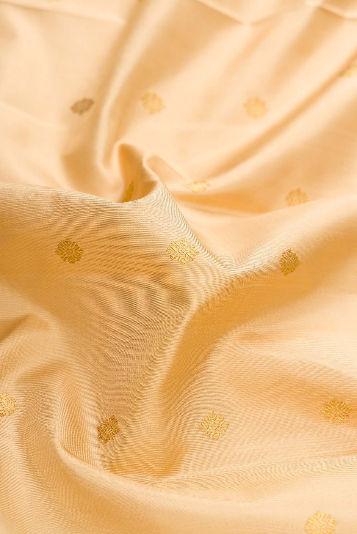 Close up of Pure Silk Pure Zari Sandal Dual Tone Kanchipuram Saree with Zari Butta on the body and Zari Border displaying folds
