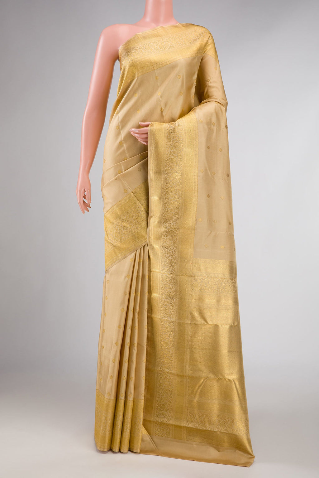 Pure Silk Pure Zari Sandal Dual Tone Kanchipuram Saree with Zari Butta on the body and Zari Border displayed on a mannequin