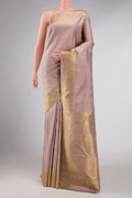 Pure Silk Pure Zari Rose Gold Dual Tone Kanchipuram Saree with Zari Butta on the body and Zari Border displayed on a mannequin