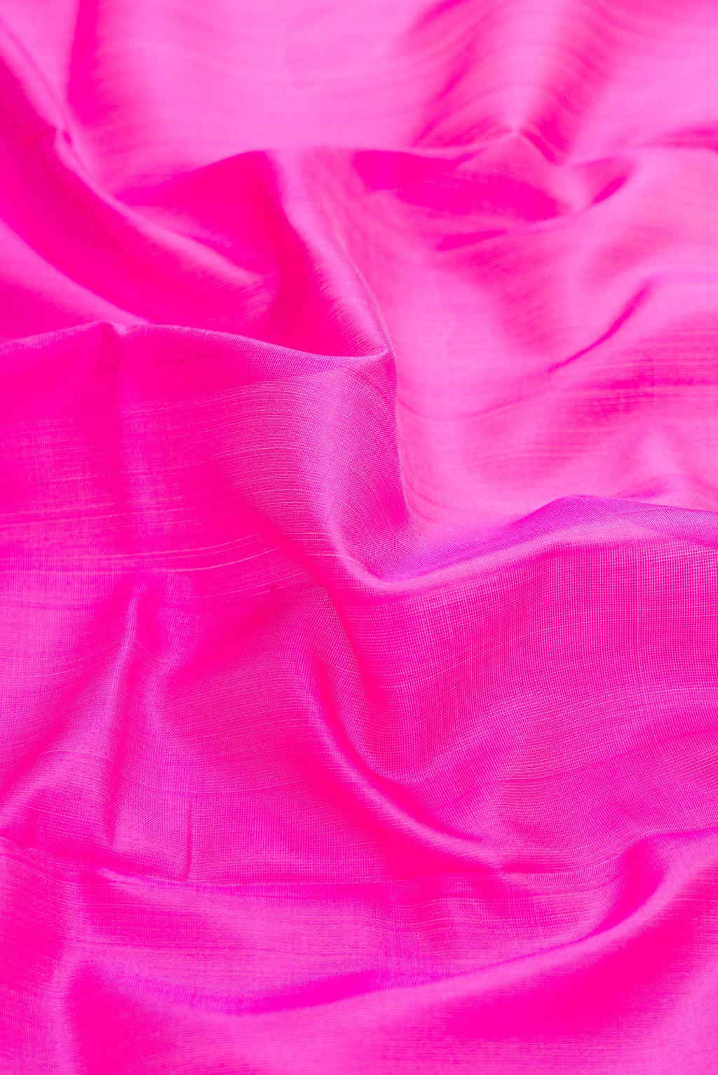 Close up of Pink Dual Tone Uppada Silk Saree with Plain Body and Zari Border displaying folds