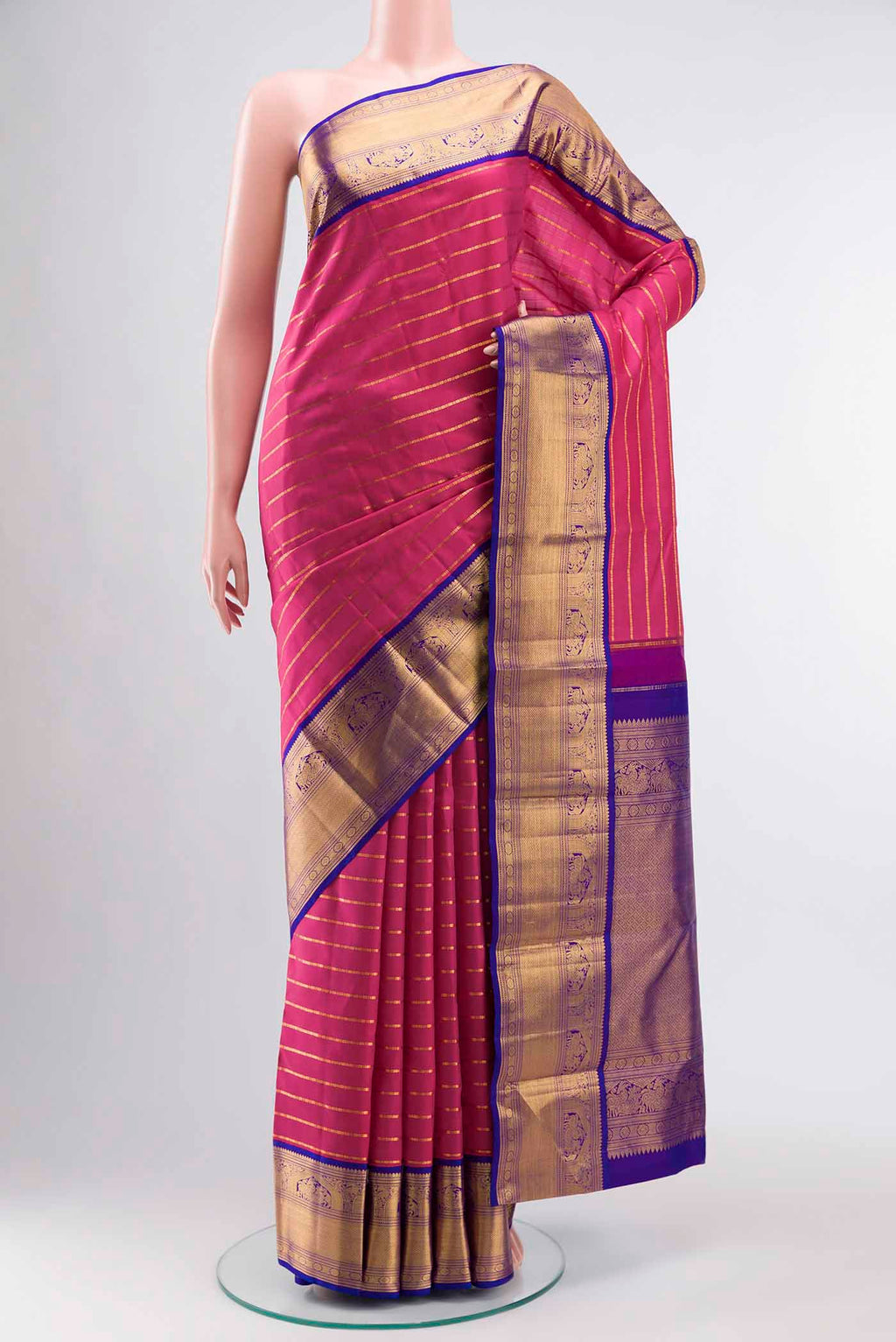 Pink Kanchipuram Silk Saree with Stripes on the body and Zari Border displayed on a mannequin