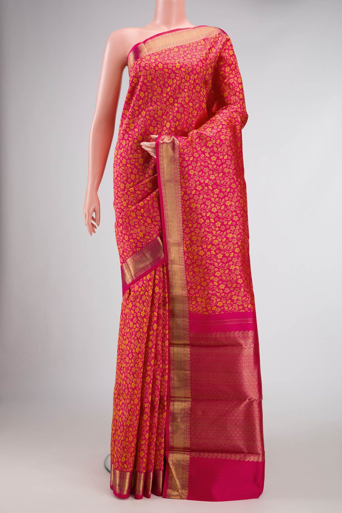 Pure Silk Pure Zari Pink Dual Tone Kanjivaram Saree with Jacquard design on the body and Zari Border.  displayed on a mannequin