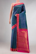 Peacock Blue Dual Tone Kanchipuram Silk Saree with Stripes on the body and Zari Border displayed on a mannequin