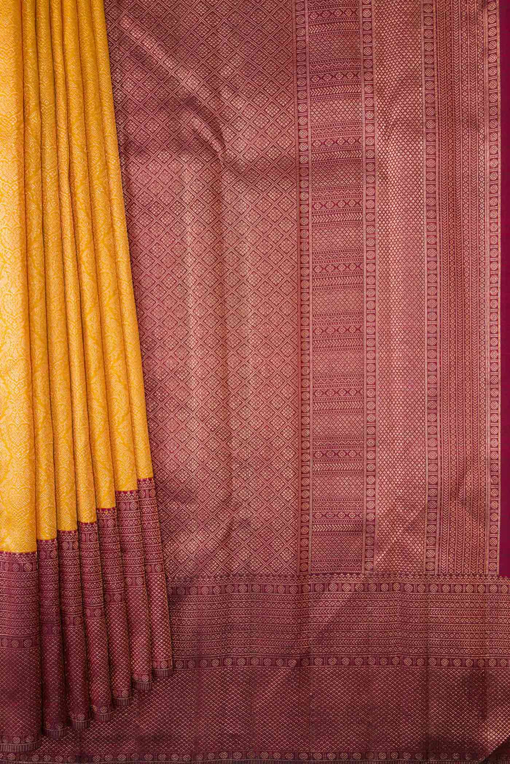Pleats and pallu of Mustard Dual Tone Kanchipuram Silk Saree with Zari Brocade on the body and Zari Border