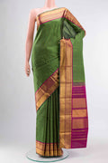 Green Kanchipuram Silk Saree with Checked design on the body and Zari Border displayed on a mannequin