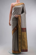 Grey Kanchipuram Silk Saree with Plain Body and Zari Border displayed on a mannequin