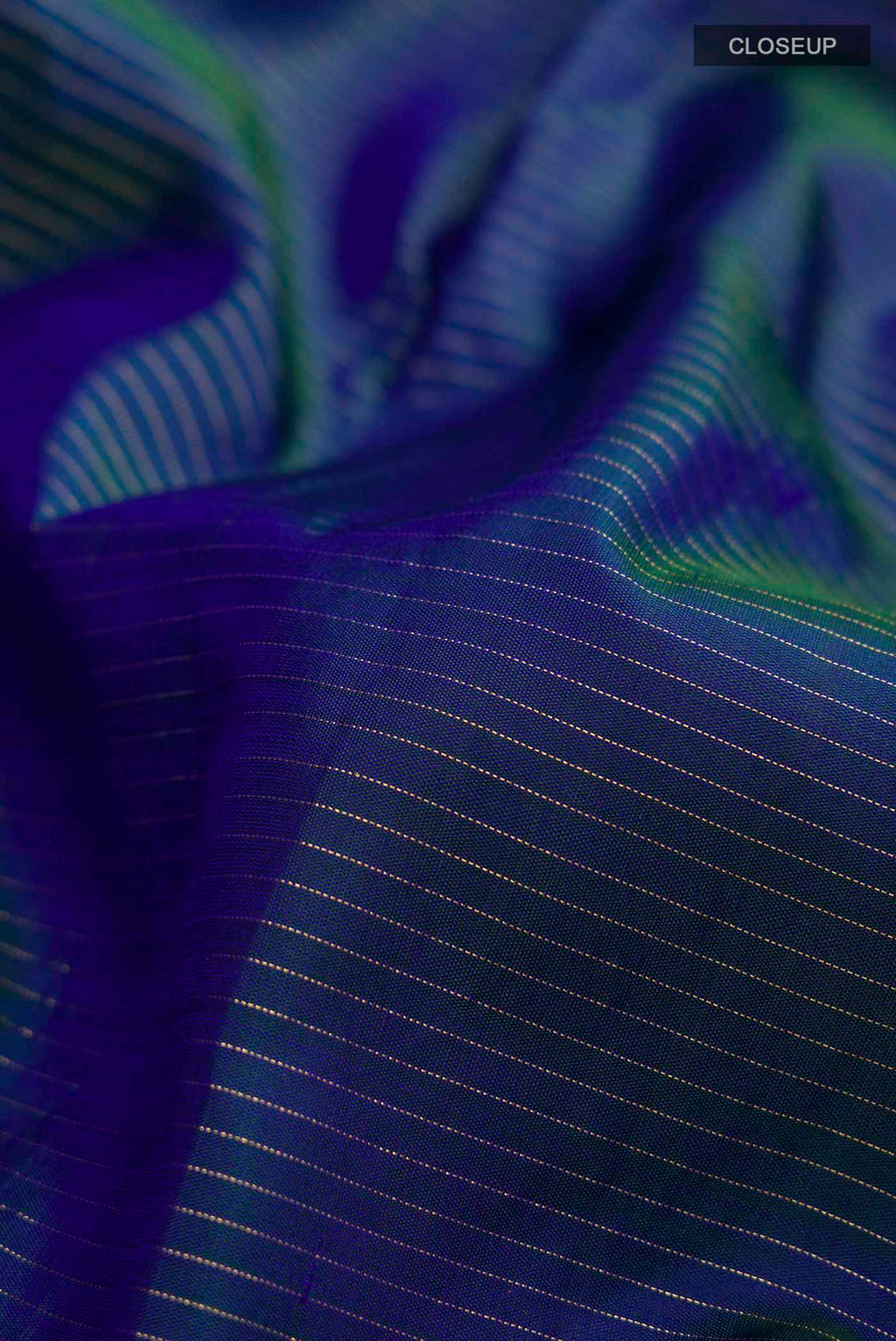 Close up of Blue Kanchipuram Silk Saree with Stripes on the body and Zari Border displaying folds