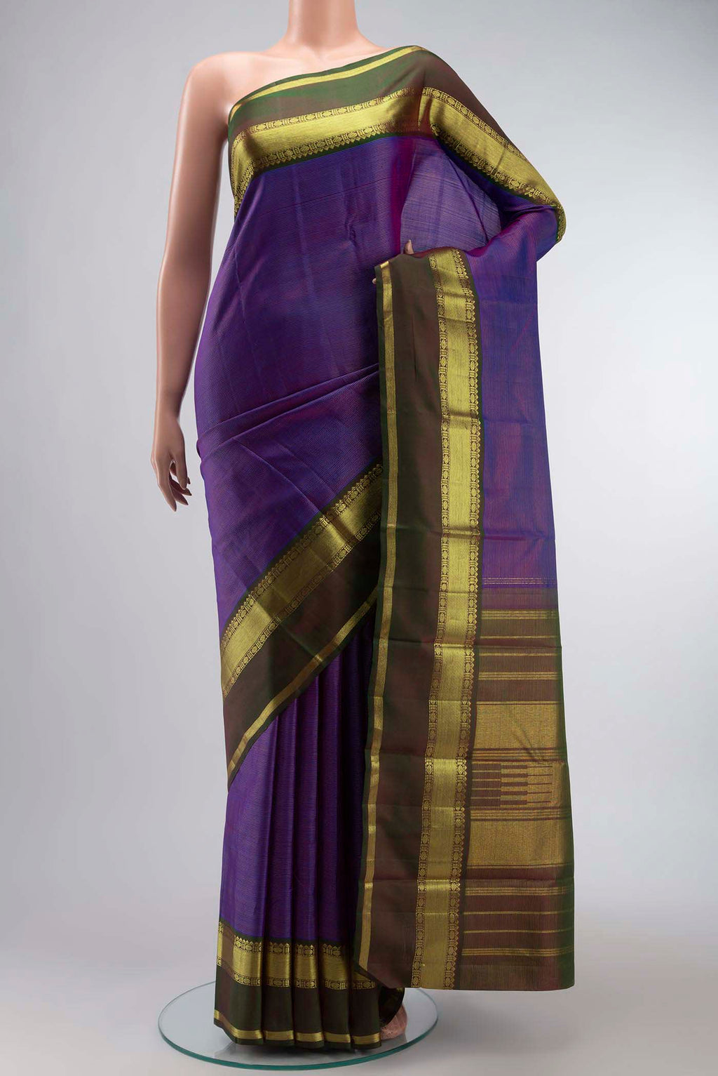 Violet Kanchipuram Silk Saree with Stripes on the body and Zari Border displayed on a mannequin