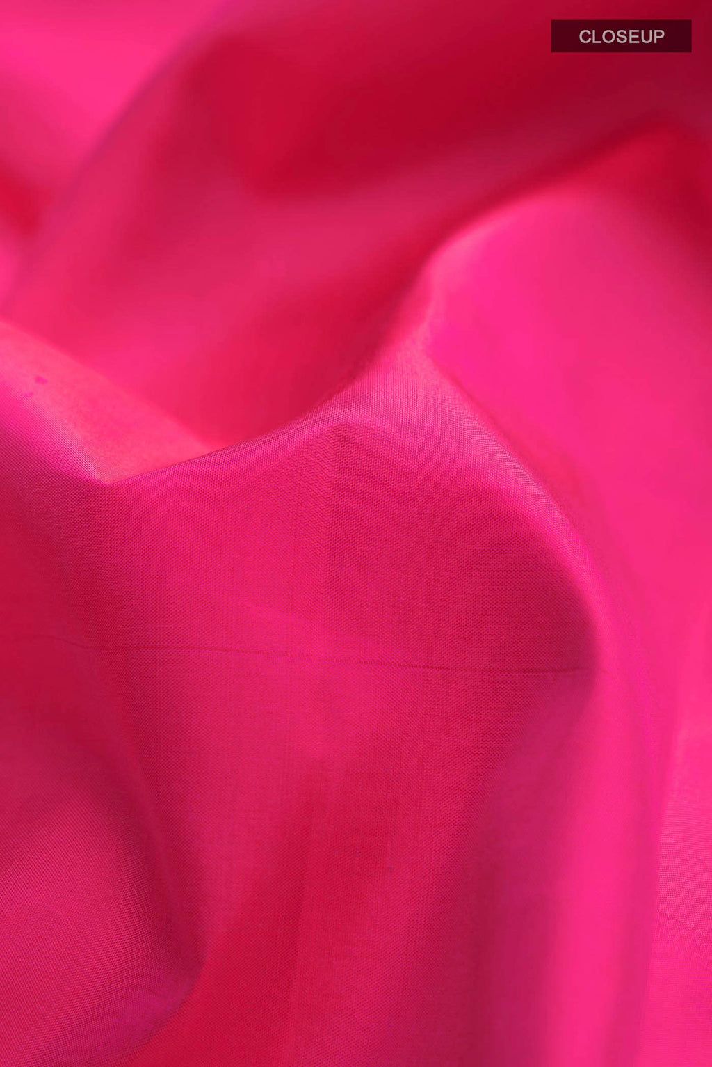 Close up of Pink Kanchipuram Silk Saree with Plain Body and Zari Border displaying folds
