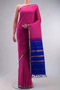 Pink Kanchipuram Silk Saree with Checked design on the body and Zari Border displayed on a mannequin
