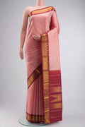 Peach Kanchipuram Silk Saree with Plain Body and Zari Border displayed on a mannequin