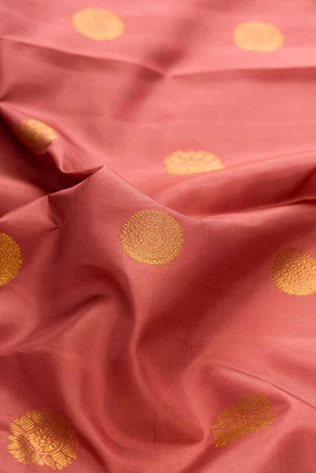 Close up of Pure Silk Pure Zari Brown Dual Tone Kanchipuram Saree with Zari Butta on the body and Fancy Border displaying folds