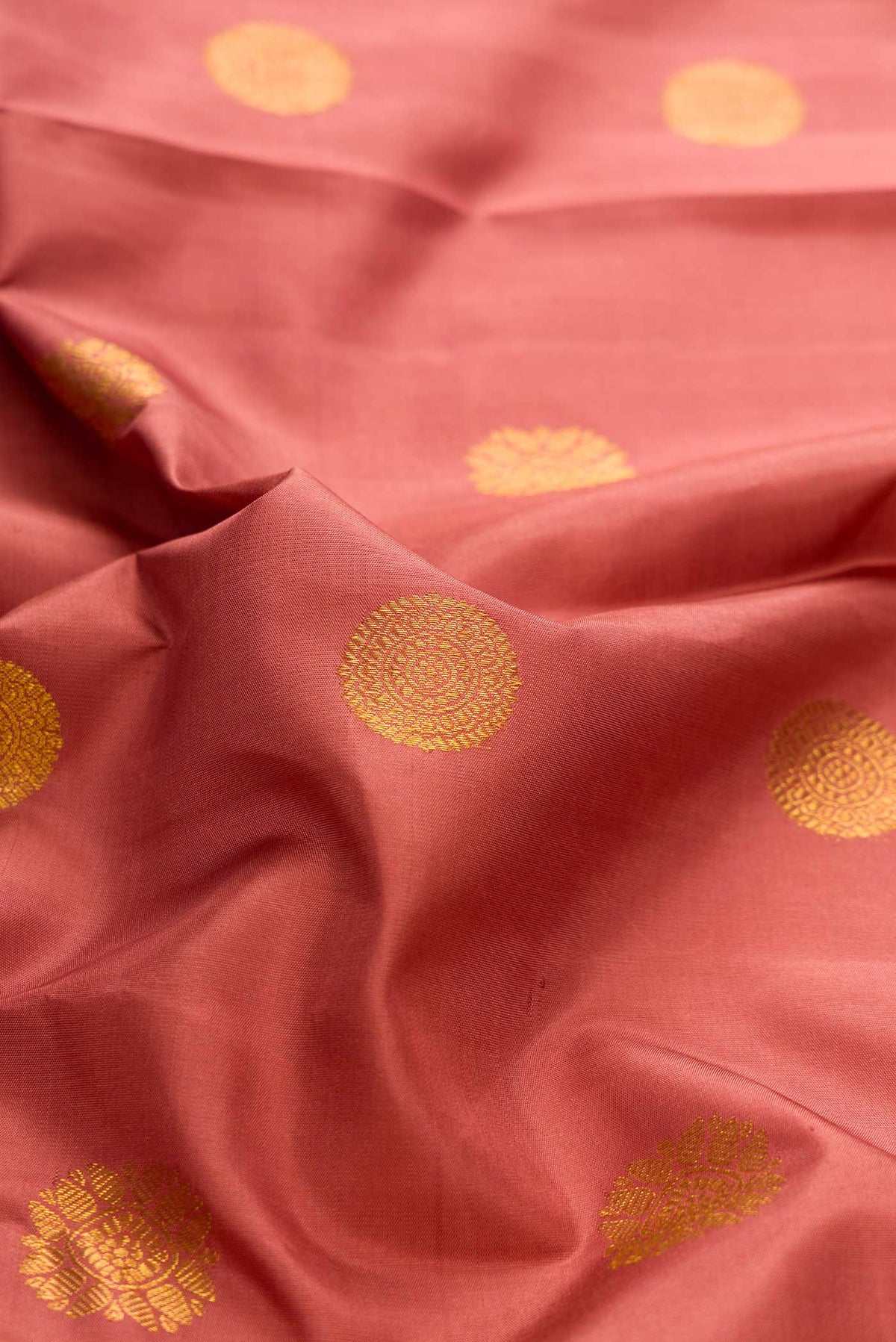 Close up of Pure Silk Pure Zari Brown Dual Tone Kanchipuram Saree with Zari Butta on the body and Fancy Border displaying folds