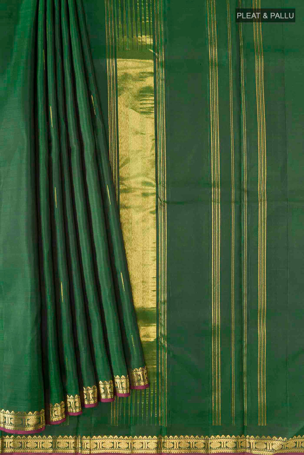 Pleats and pallu of Green Kanchipuram Silk Saree with Zari Butta on the body and Zari Border