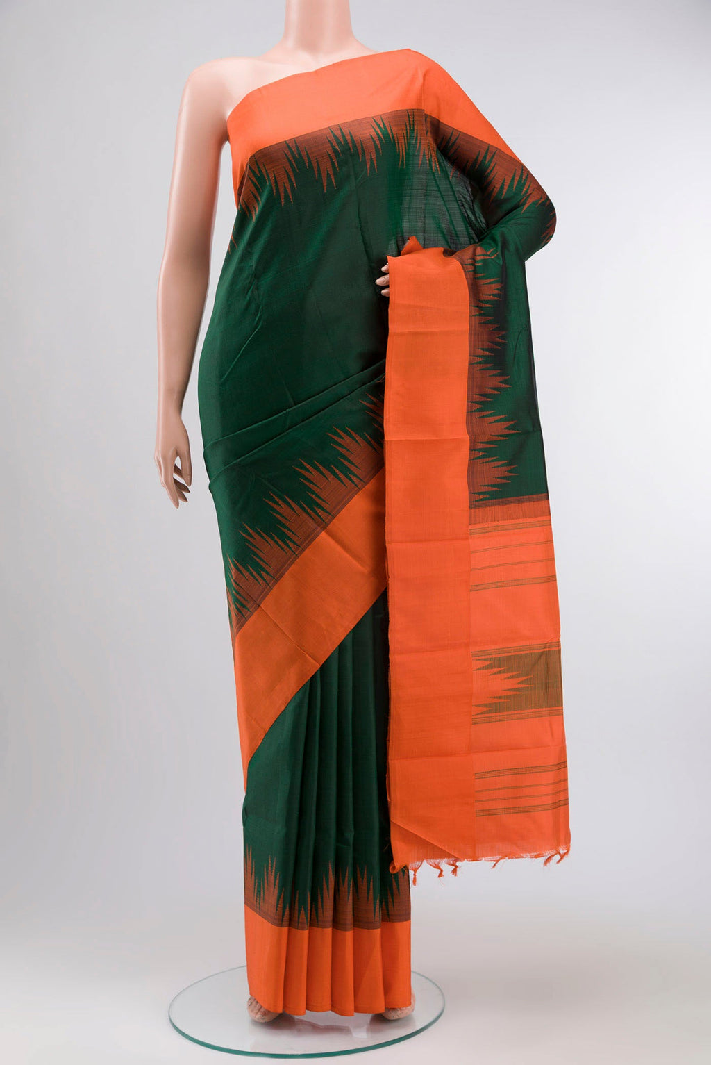 Green Kanchipuram Silk Saree with Plain Body and Temple Border displayed on a mannequin