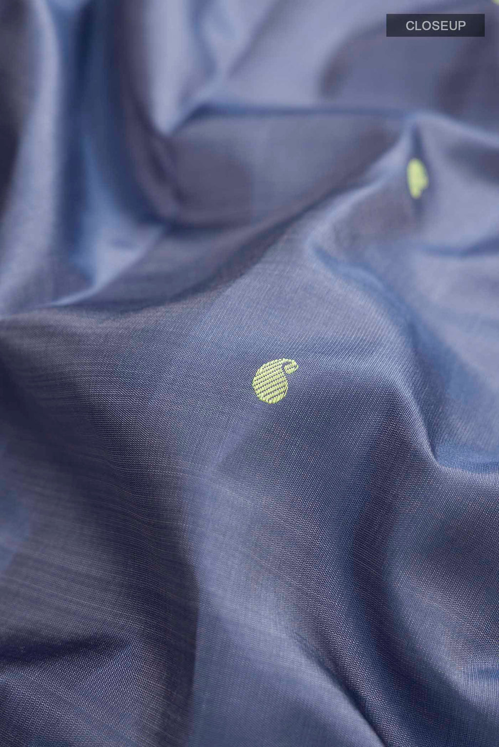 Close up of Blue Kanchipuram Silk Saree with Thread Butta on the body and Zari Border displaying folds