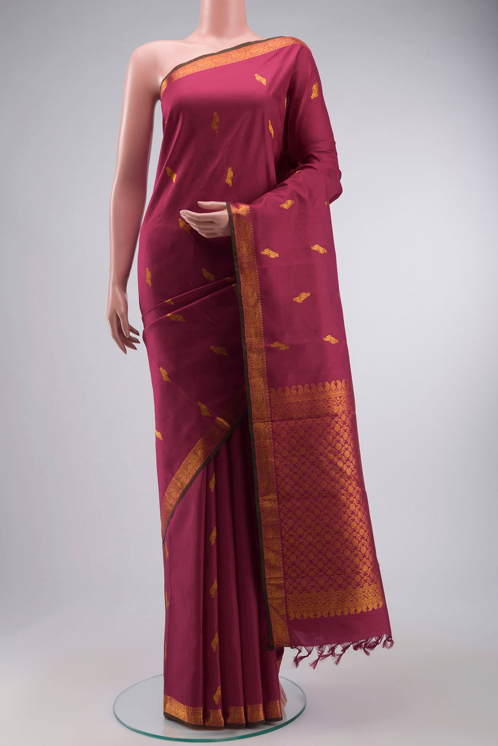 Maroon Kanchipuram Silk Saree with Zari Butta on the body and Zari Border displayed on a mannequin