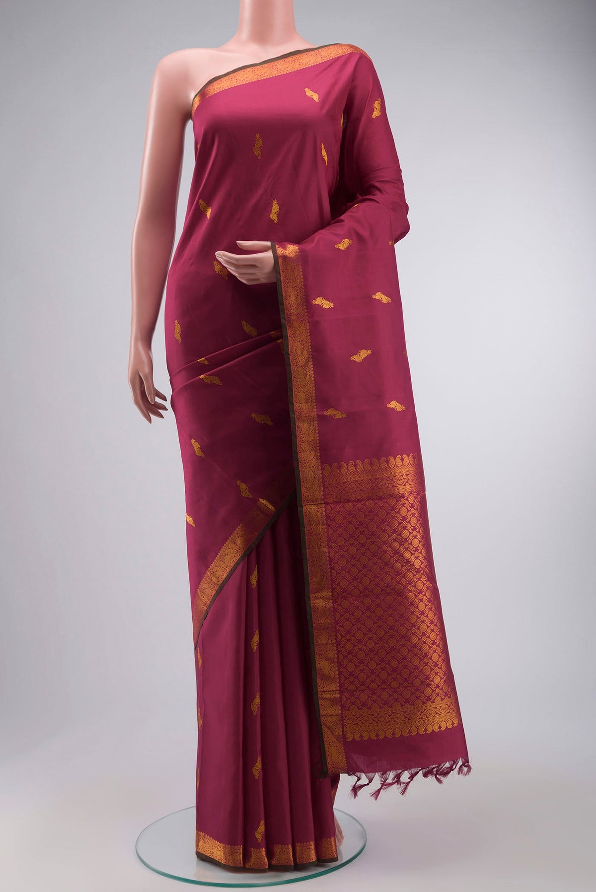 Maroon Kanchipuram Silk Saree with Zari Butta on the body and Zari Border displayed on a mannequin