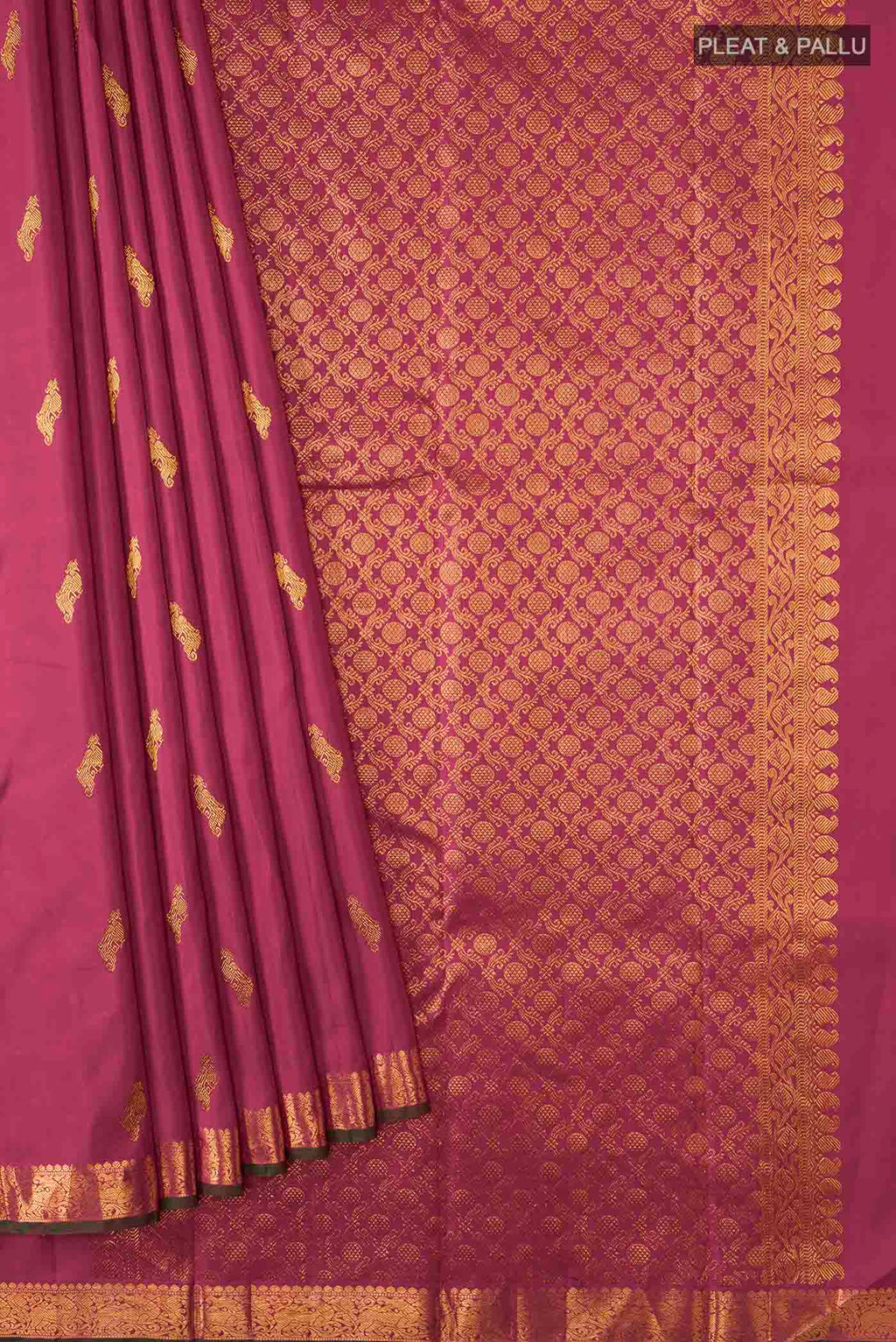 Pleats and pallu of Maroon Kanchipuram Silk Saree with Zari Butta on the body and Zari Border