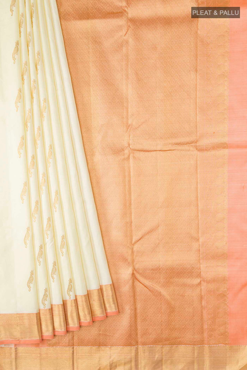 Pleats and pallu of Cream Kanchipuram Silk Saree with Zari Butta on the body and Zari Border