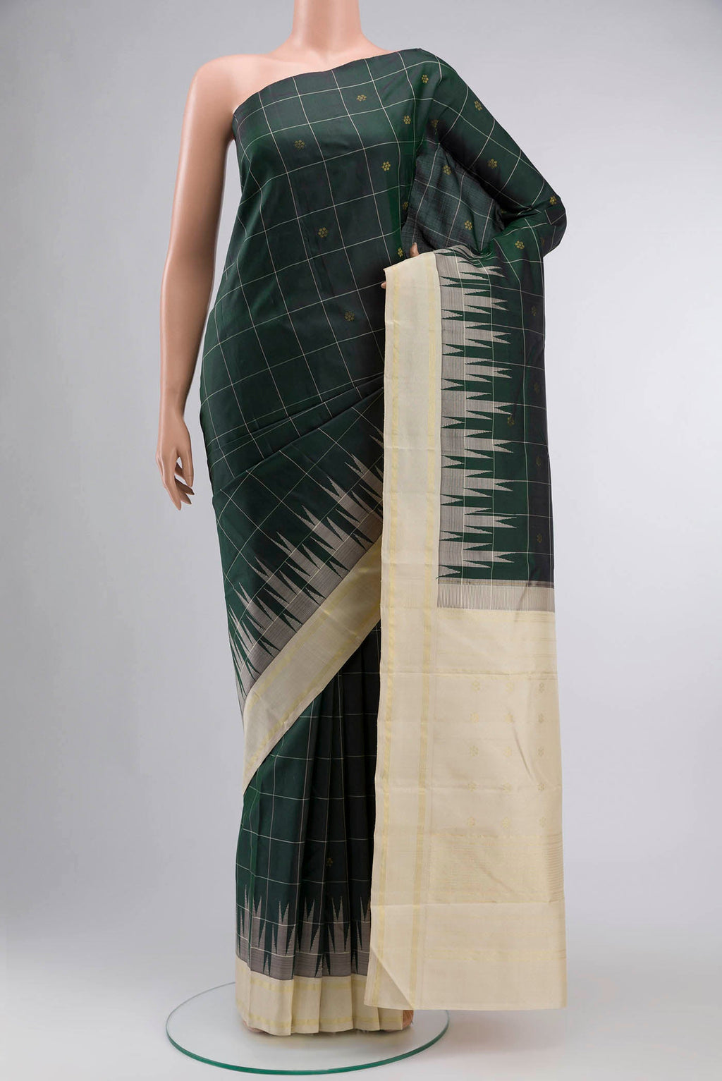 Green Kanchipuram Silk Saree with Zari Butta on the body and Zari Border displayed on a mannequin