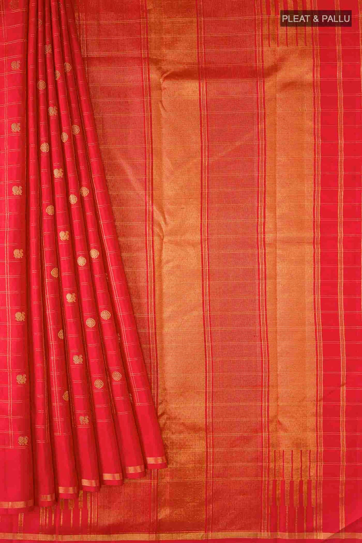 Pleats and pallu of Red Kanchipuram Silk Saree with Zari Butta on the body and Zari Border