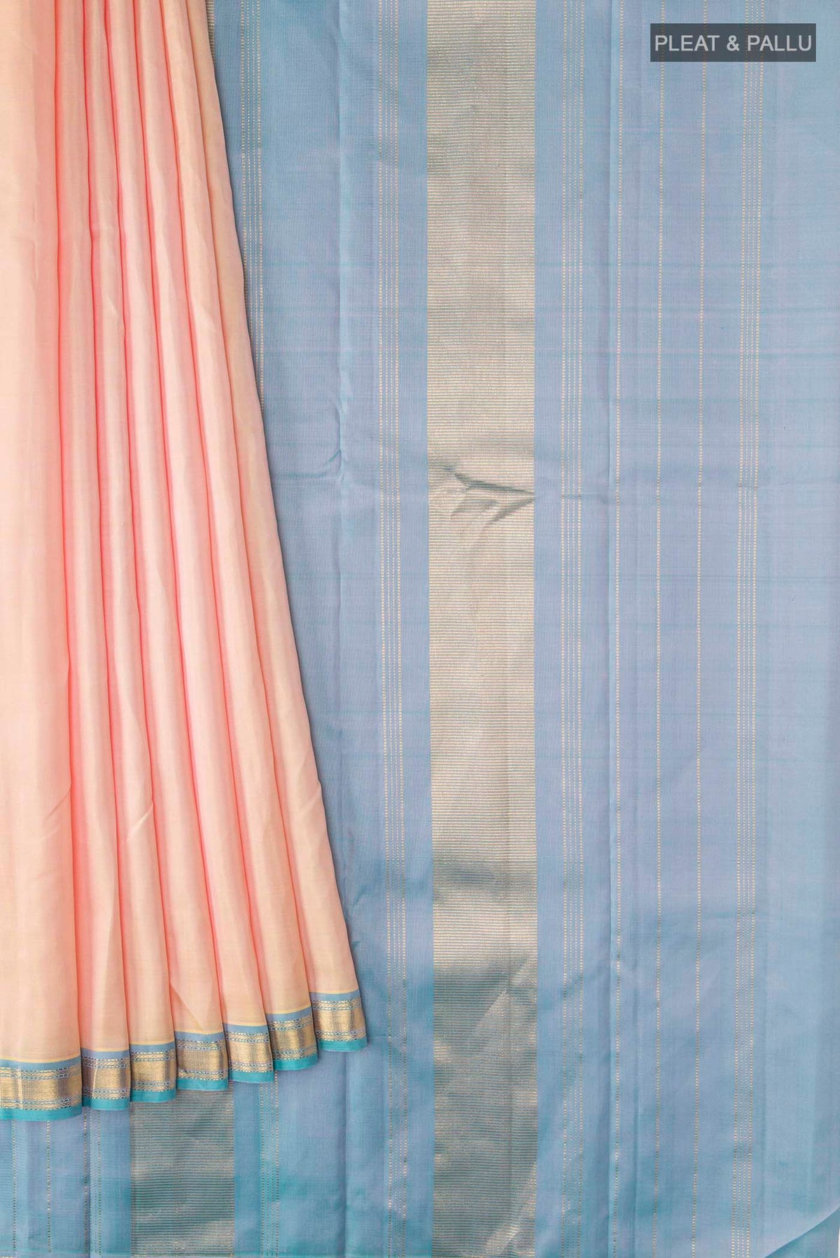 Pleats and pallu of Rose Gold Kanchipuram Silk Saree with Plain Body and Zari Border