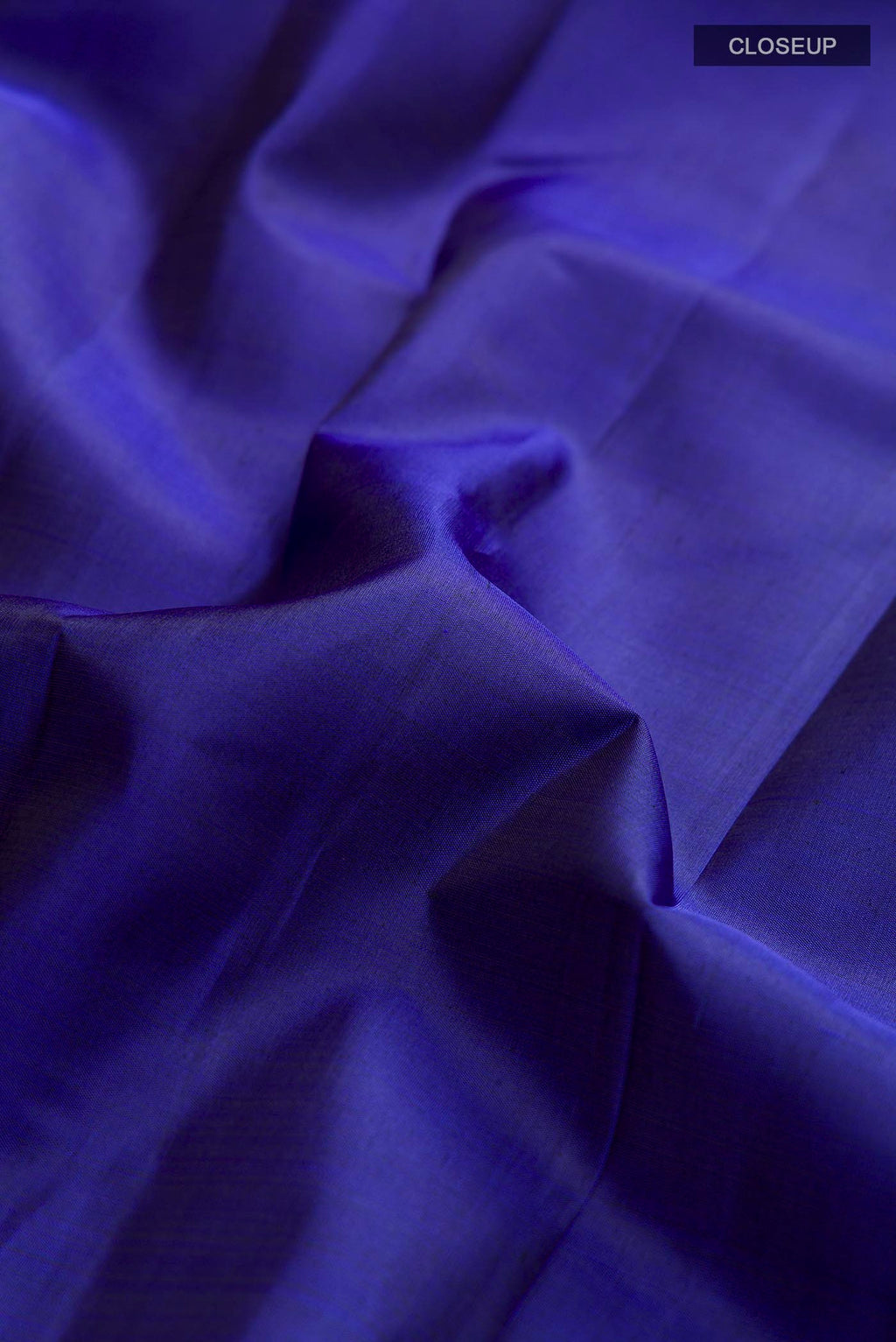 Close up of Blue Kanchipuram Silk Saree with Plain Body and Zari Border displaying folds