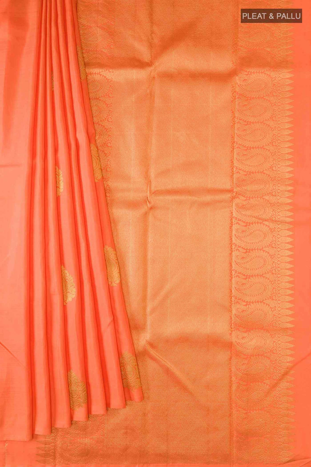 Pleats and pallu of Orange Kanchipuram Silk Saree with Zari Butta on the body and Without Border