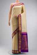 Cream Kanchipuram Silk Saree with Plain Body and Zari Border displayed on a mannequin