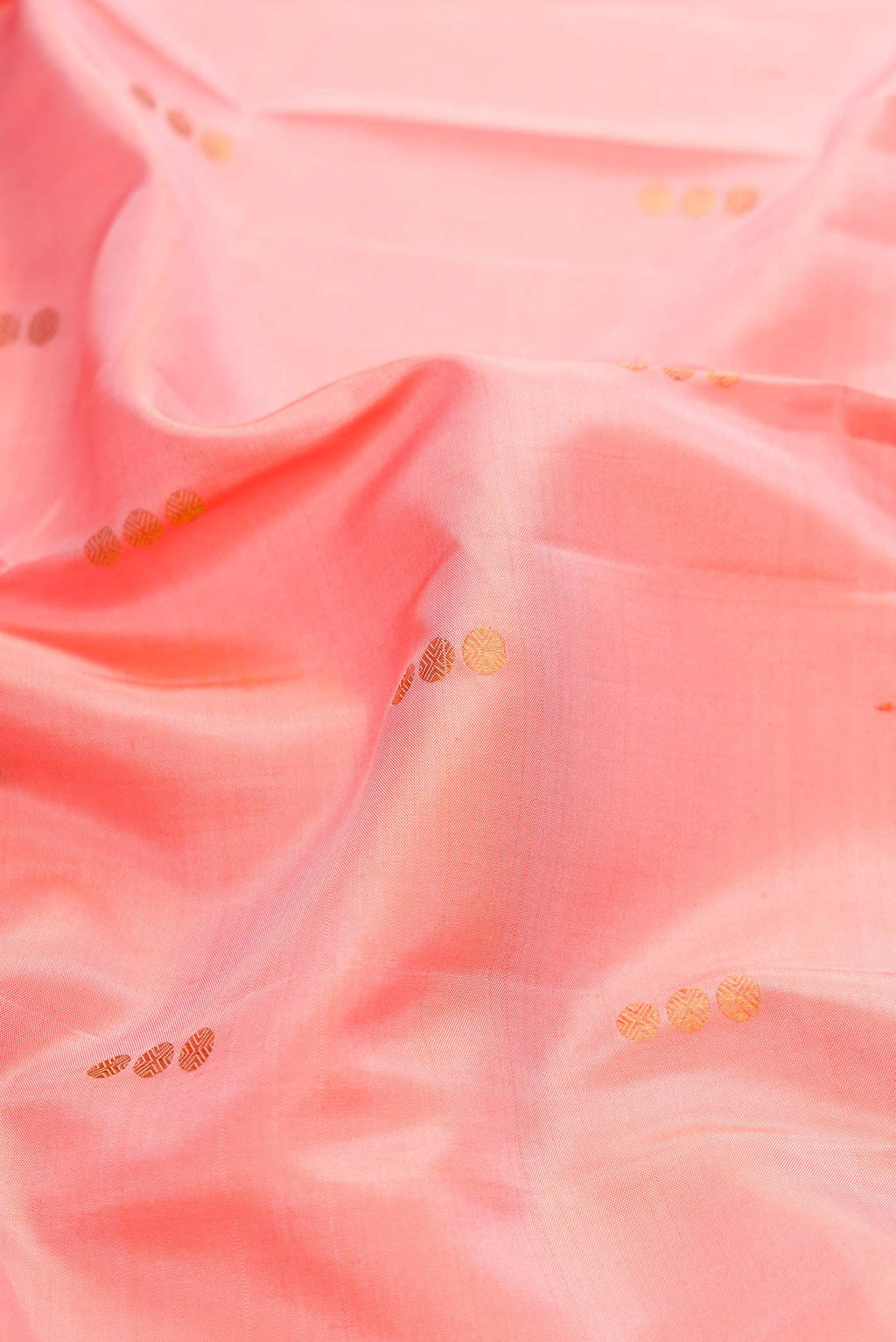 Close up of Pink Dual Tone Kanchipuram Silk Saree with Zari Butta on the body and Zari Border displaying folds