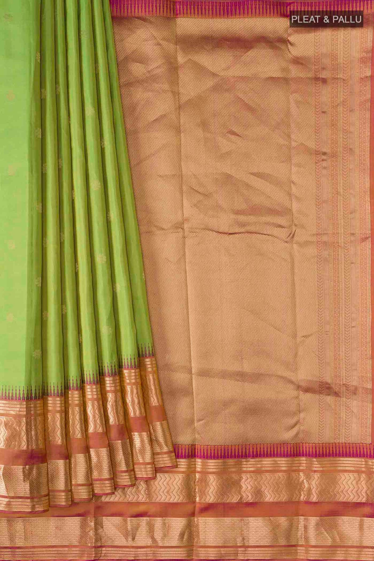 Pleats and pallu of Green Kanchipuram Silk Saree with Zari Butta on the body and Zari Border