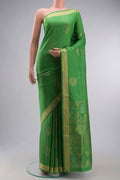 Green Soft Silk Saree with Zari Butta on the body and Zari Border displayed on a mannequin