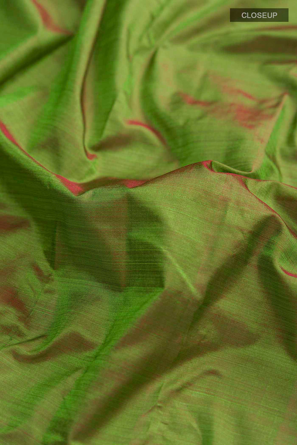 Close up of Green Kanchipuram Silk Saree with Plain Body and Zari Border displaying folds