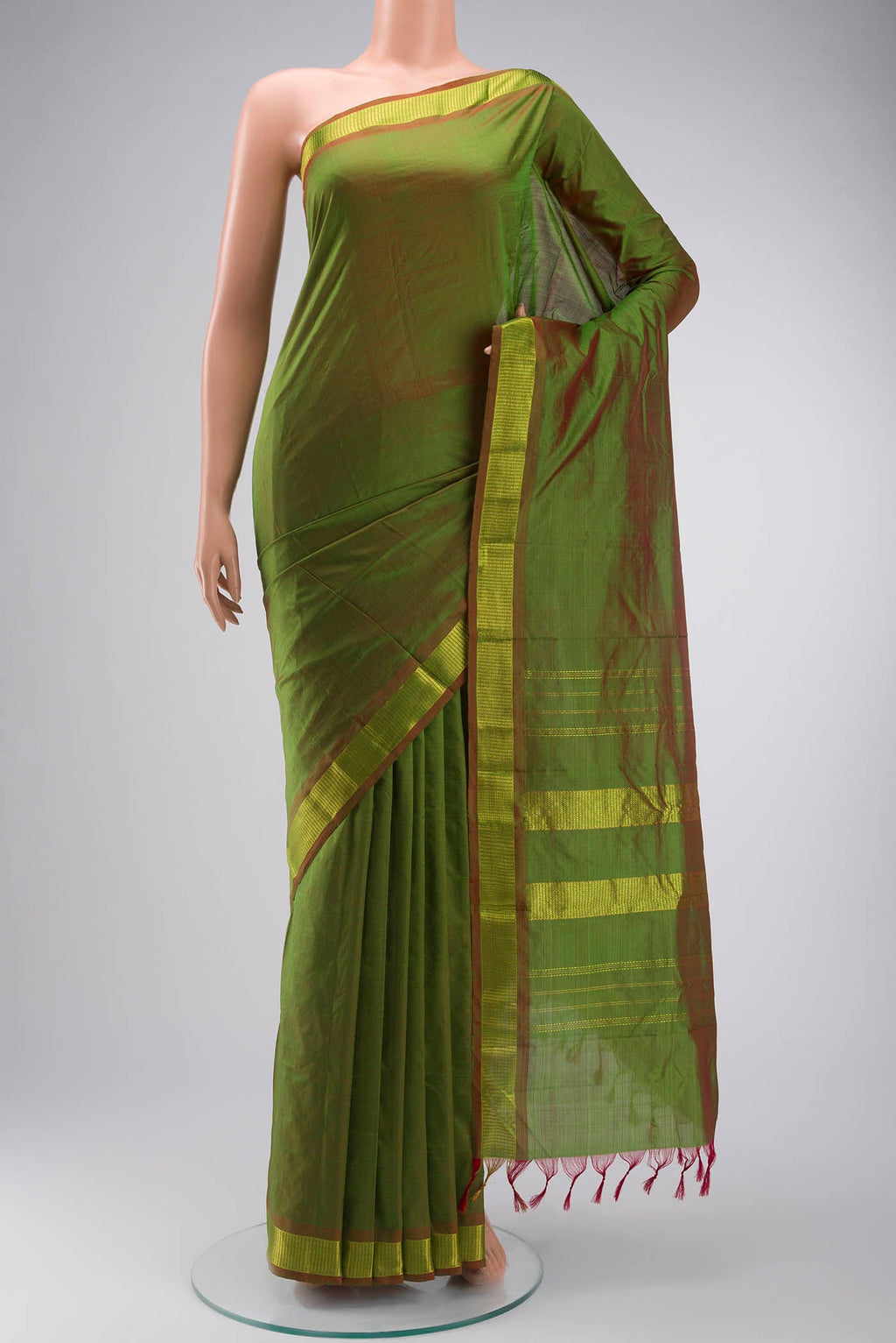 Green Kanchipuram Silk Saree with Plain Body and Zari Border displayed on a mannequin