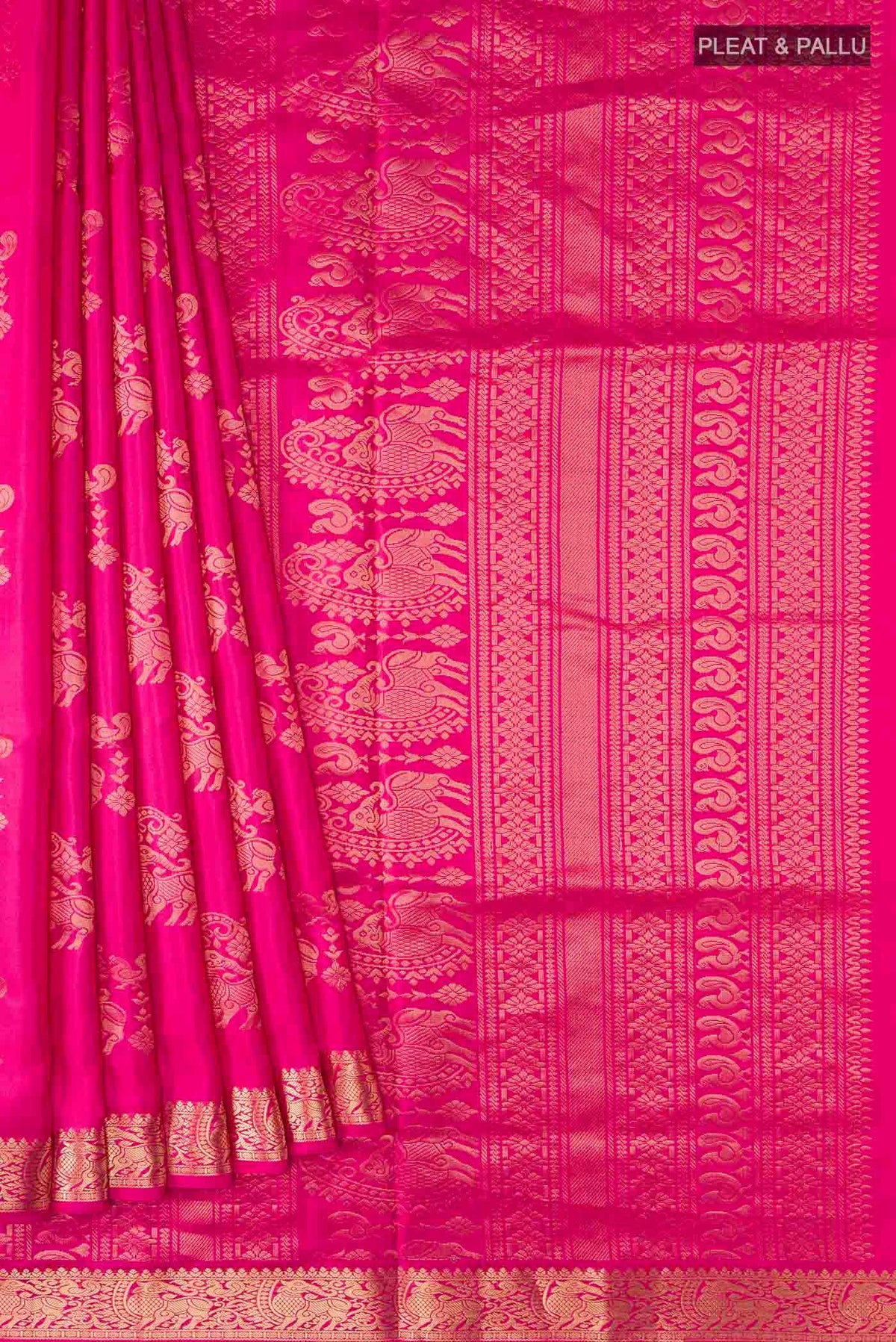 Pleats and pallu of Pink Soft Silk Saree with Zari Butta on the body and Zari Border