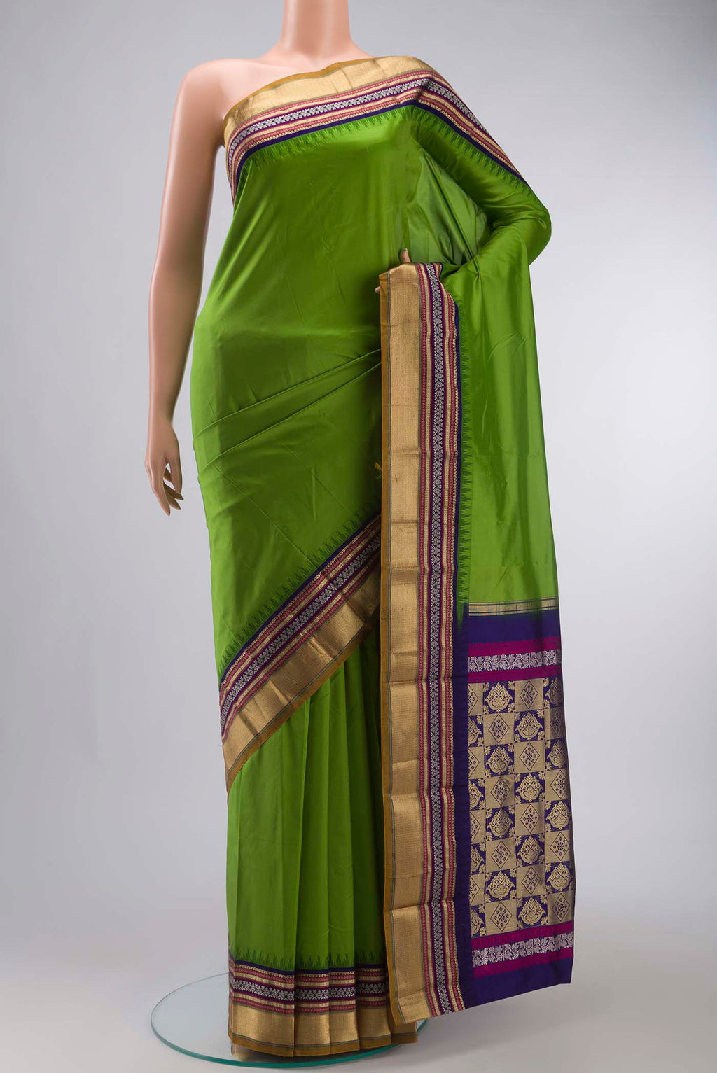 Green Bangalore Silk Saree with Plain Body and Zari And Thread Border displayed on a mannequin