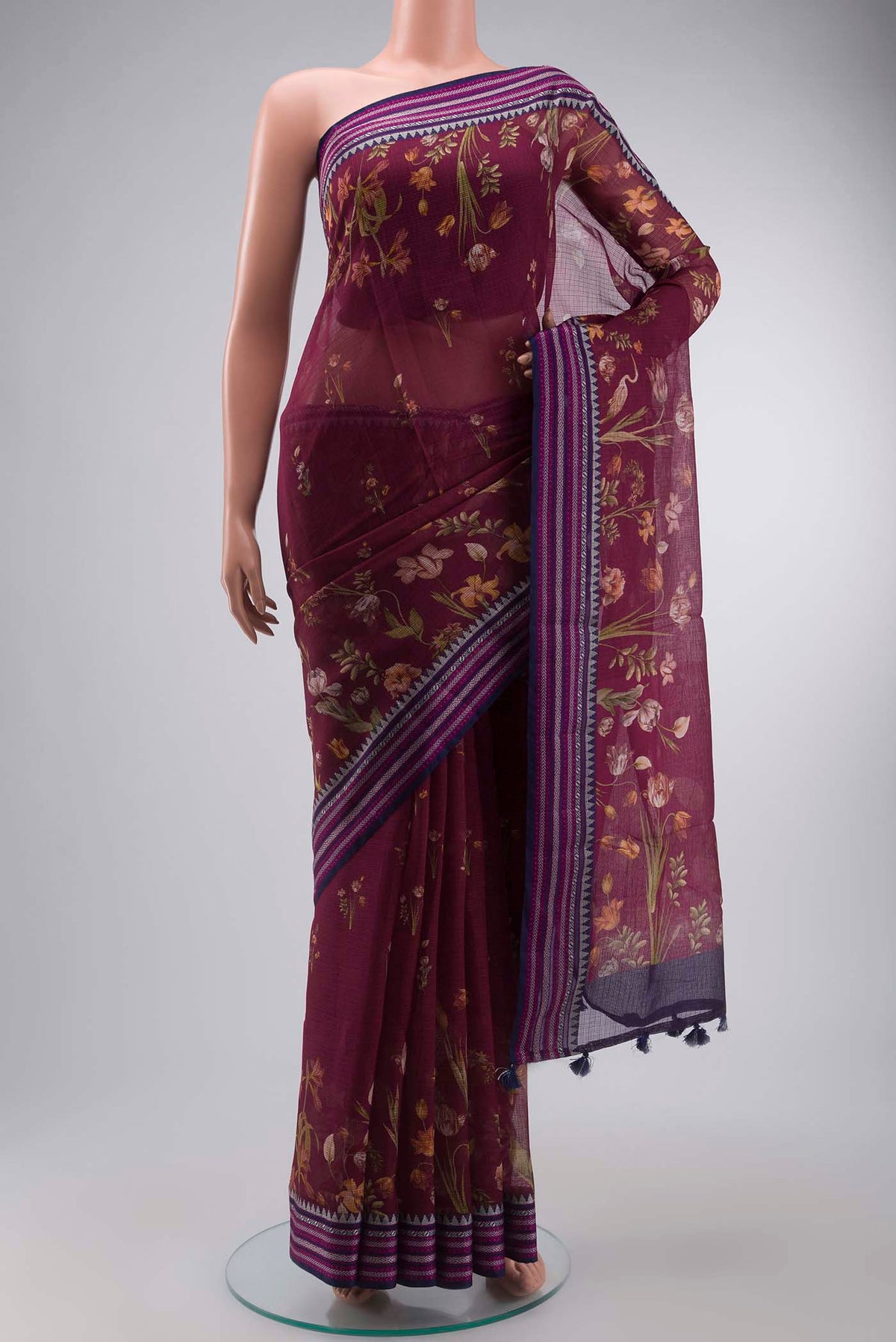 Magenta Kota Cotton Saree with Printed design on the body and Thread Border displayed on a mannequin