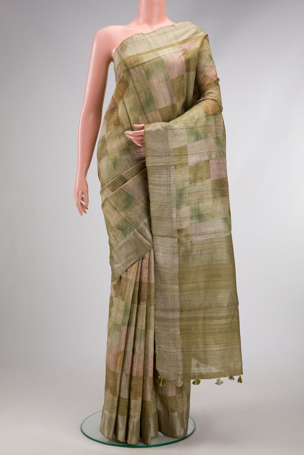 Pista Green Dual Tone Tussar Silk Saree with Checked design on the body and Zari Border.  displayed on a mannequin
