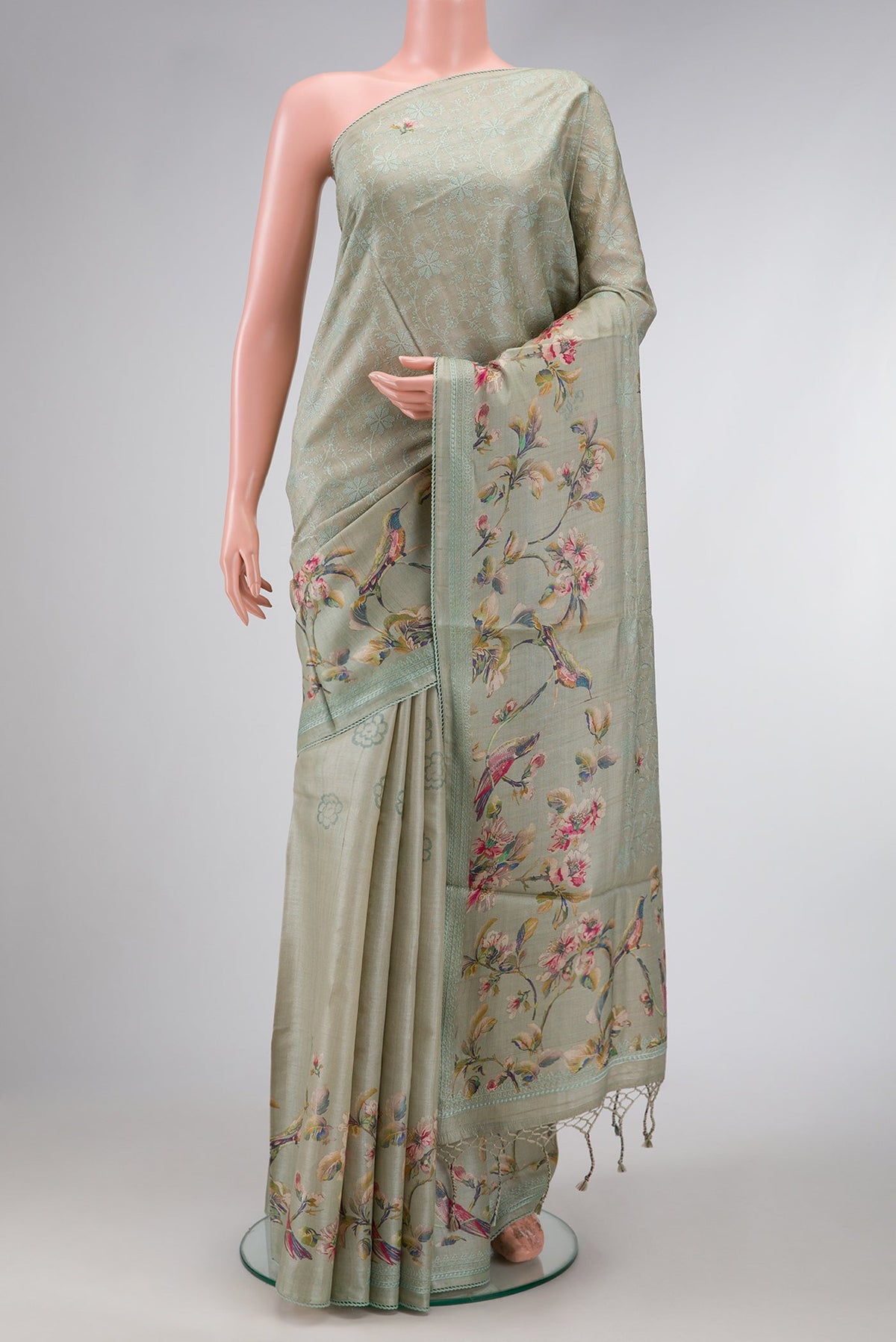 Grey Dual Tone Tussar Silk Saree with Printed design on the body and Embroidery Border.  displayed on a mannequin