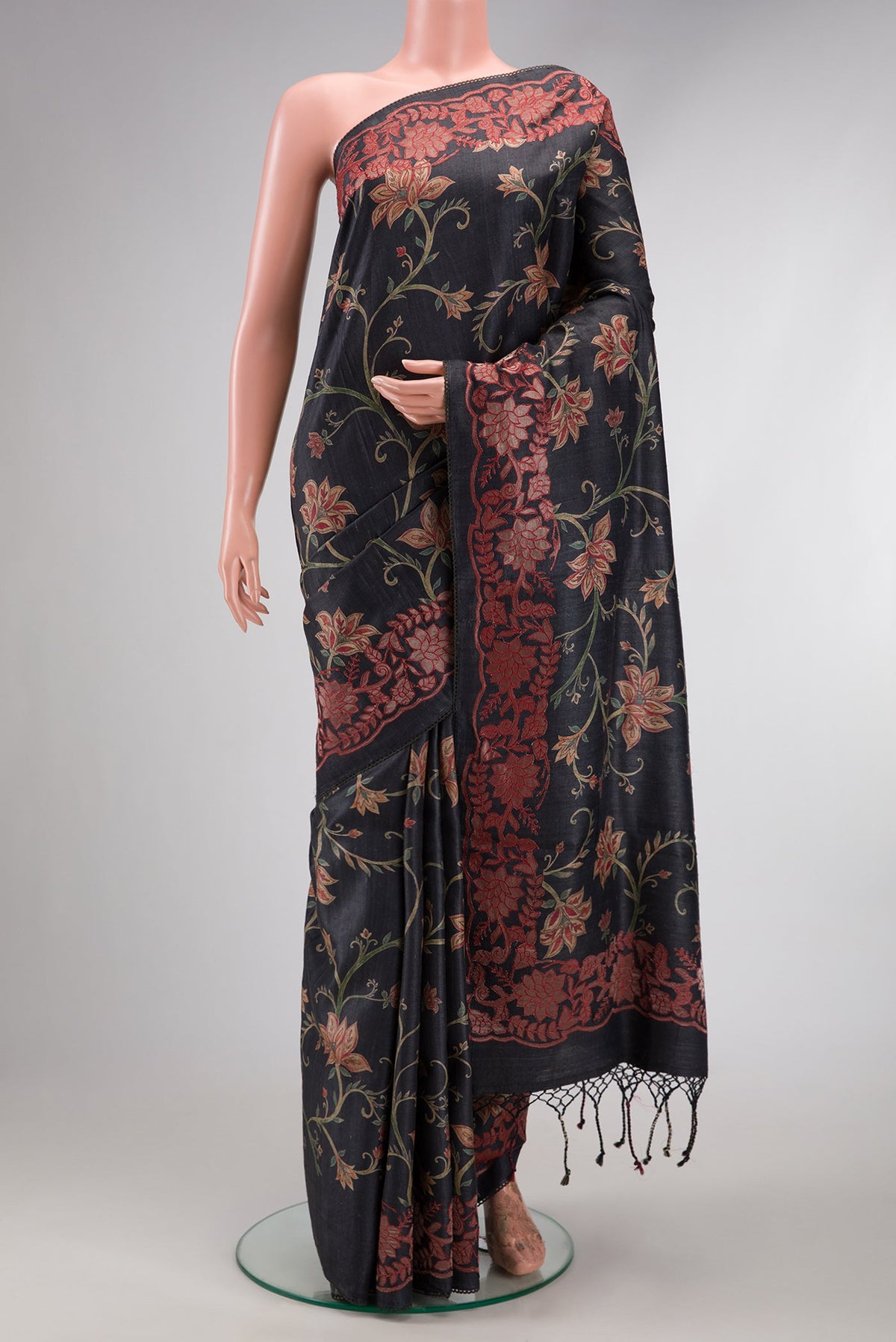 Black Dual Tone Tussar Silk Saree with Printed design on the body and Embroidery Border.  displayed on a mannequin