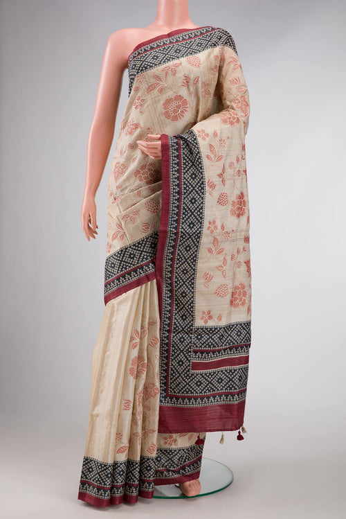 Beige Dual Tone Tussar Silk Saree with Printed design on the body and Printed Border displayed on a mannequin