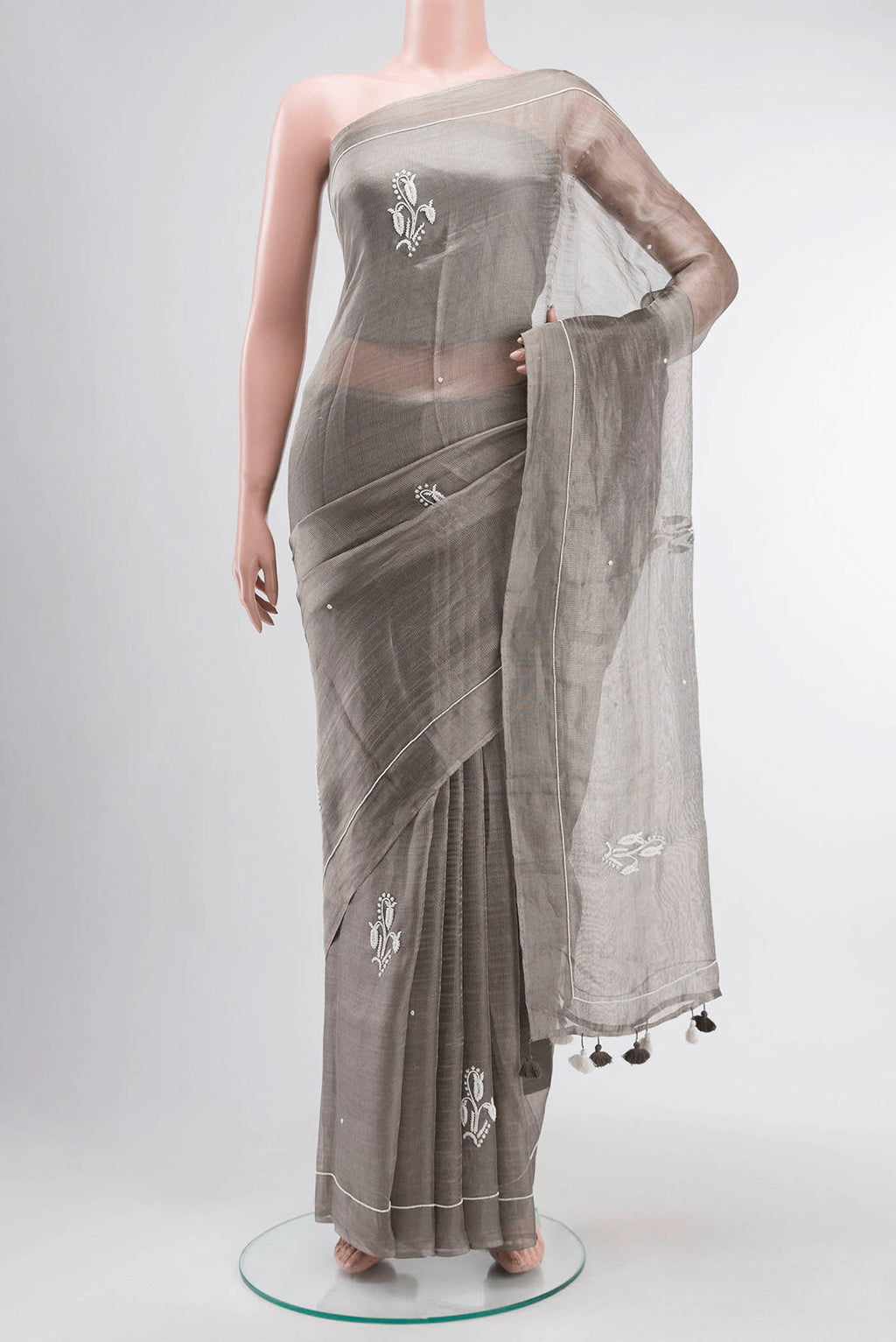 Grey Tissue Silk Saree with Embroidery on the body and Embroidery Border displayed on a mannequin
